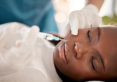 Buy stock photo Face, syringe and skincare, black woman at spa with collagen injection for skincare and beauty treatment. Dermatology, cosmetics and person at salon with needle in skin for anti aging facial process.