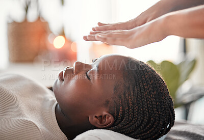 Buy stock photo Relax, reiki and black woman with lying at spa for spiritual chakra therapy and alternative medicine. Healing, balance and zen, person with peaceful mindset and healthy mind at traditional massage.