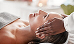 Face massage, spa and skincare woman with luxury wellness, peace and calm for beauty treatment. Facial therapist and hands for person zen, healing and stress relief while relax on table in bokeh