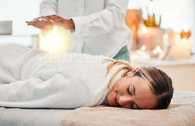 Buy stock photo Relax, reiki and woman on bed at spa for chakra therapy with light energy and holistic medicine. Spiritual healing, balance and zen, person with peaceful and healthy mindset at traditional massage.