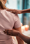 Closeup, arm and chiropractor with woman for physiotherapy, injury and alignment in consultation room. Physiotherapist, hands and injured girl consulting professional for joint, problem and issue