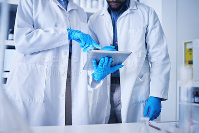 Buy stock photo Tablet, science and hands with a team working on research in a lab together for innovation or growth. Doctor, teamwork or medical with a black man and woman scientist at work in a laboratory