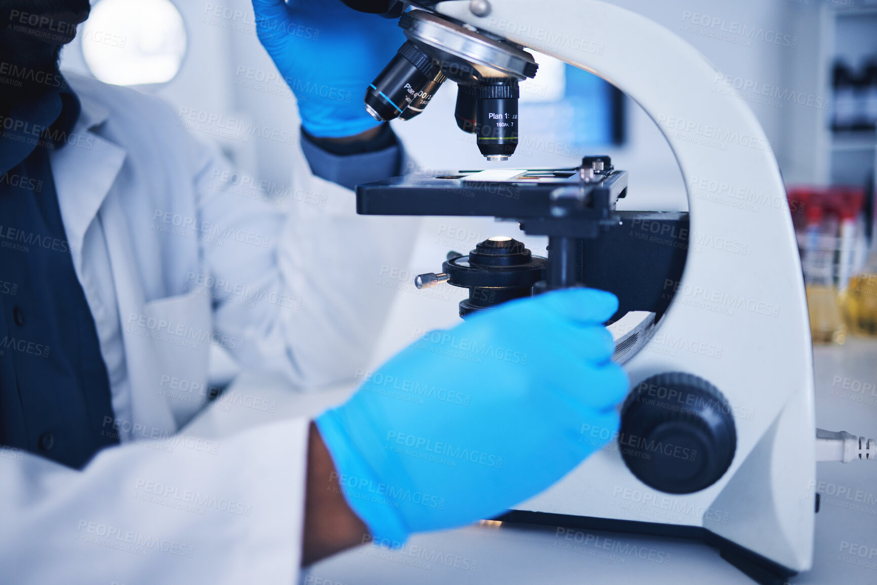 Buy stock photo Science, microscope and hands of a scientist in a lab doing research, experiment or test. Innovation, biotechnology and female scientific researcher working with equipment to examine in a laboratory.