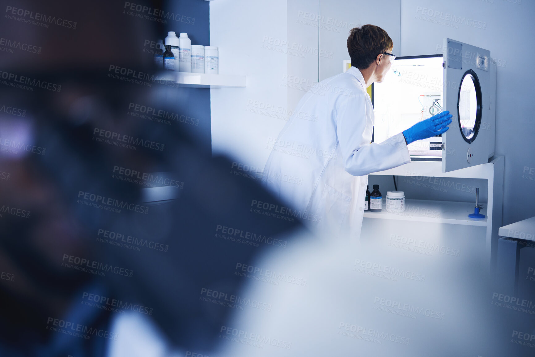 Buy stock photo Science, DNA results or black woman in lab for vaccine research, innovation or medicine test. Doctors, microscope or medical man for examination, futuristic planning or healthcare study in hospital