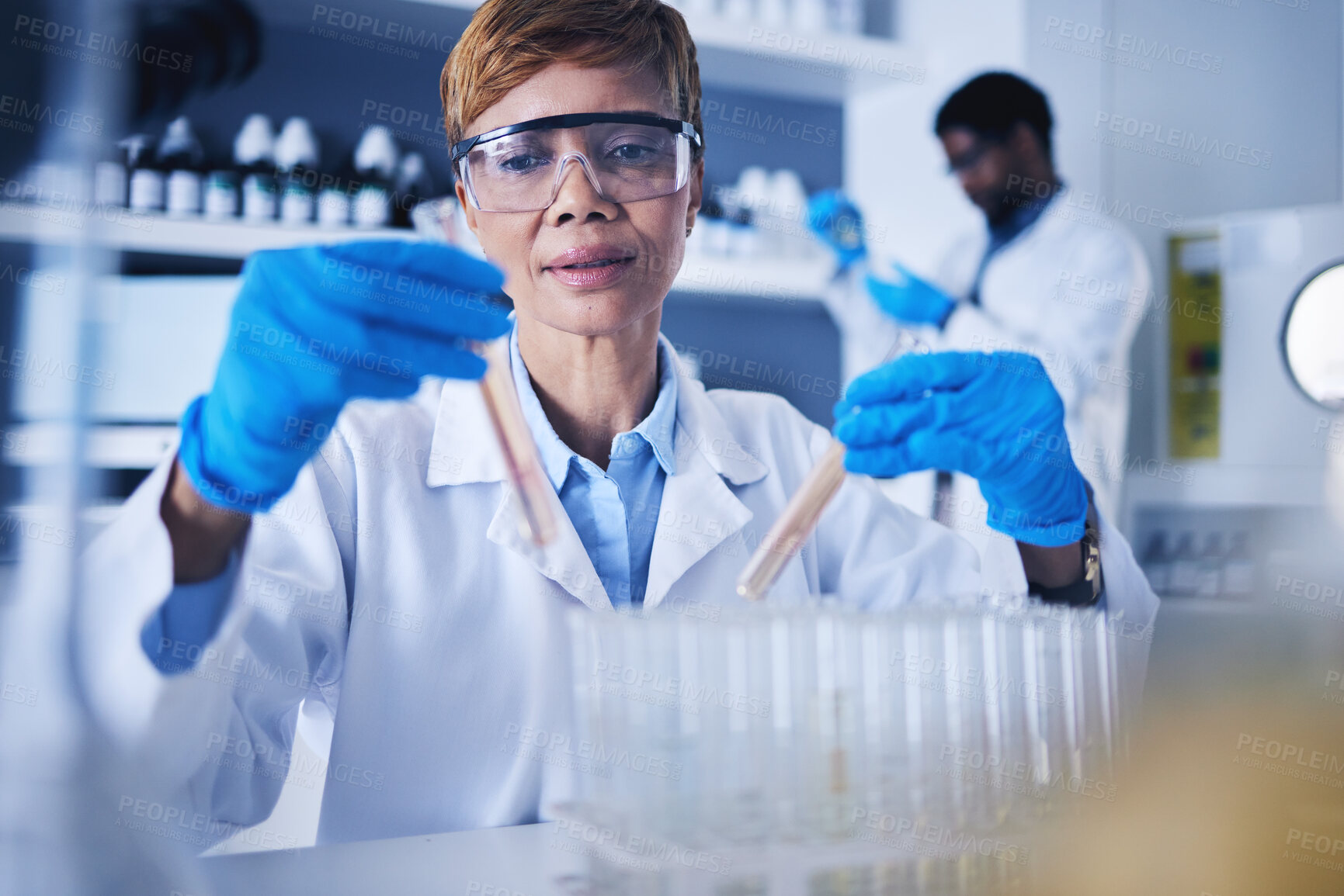 Buy stock photo Black woman, science and test tube in laboratory for research, medical study or lab experiment. Female healthcare scientist with pharmaceutical liquid sample, medicine or vials in vaccine development