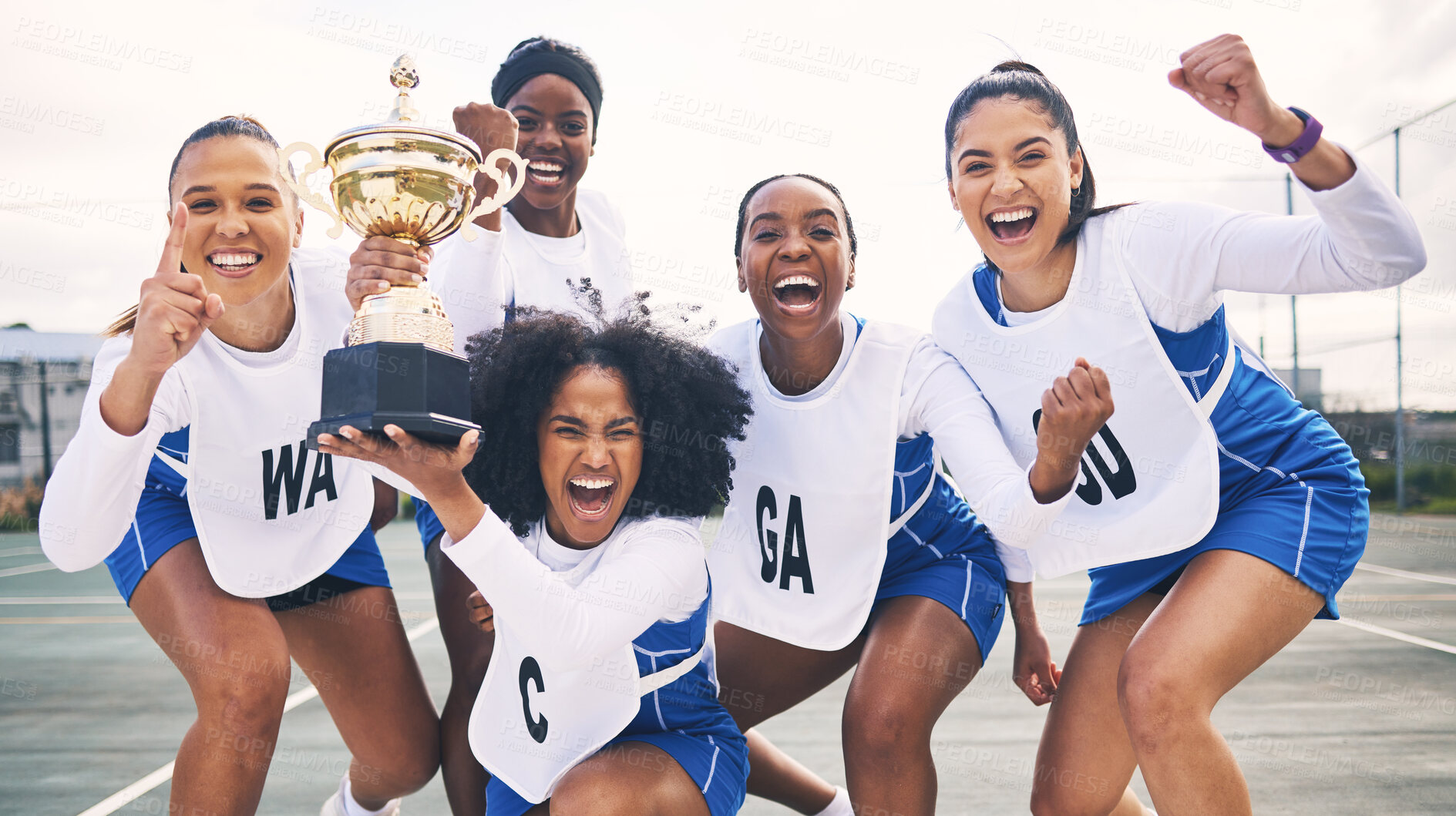 Buy stock photo Winner, netball and portrait of women with trophy for winning competition, games and sports match. Success, teamwork and excited girl athletes with award for victory, goals and achievement on court