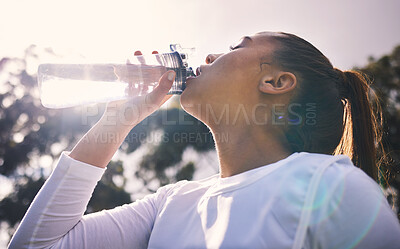 Buy stock photo Drinking water, fitness and running with a sports woman outdoor for a cardio or endurance workout. Training, exercise and wellness with a female athlete taking a drink for hydration on a break
