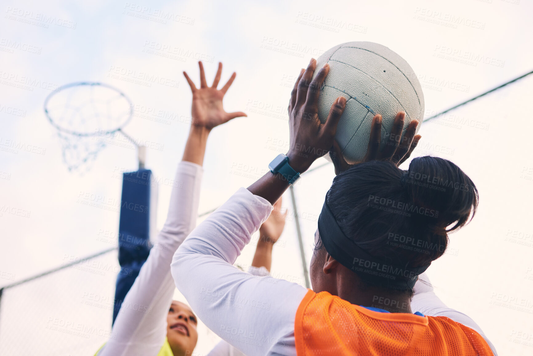 Buy stock photo Netball, goal shooter and fitness of a girl athlete group on an outdoor sports court. Aim, sport game and match challenge of a black person with a ball doing exercise and training in a competition