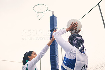 Buy stock photo Sports, netball and black woman shooting ball in match for competition, exercise or practice. Training, wellness or players playing game for workout, exercising or competitive performance outdoors.