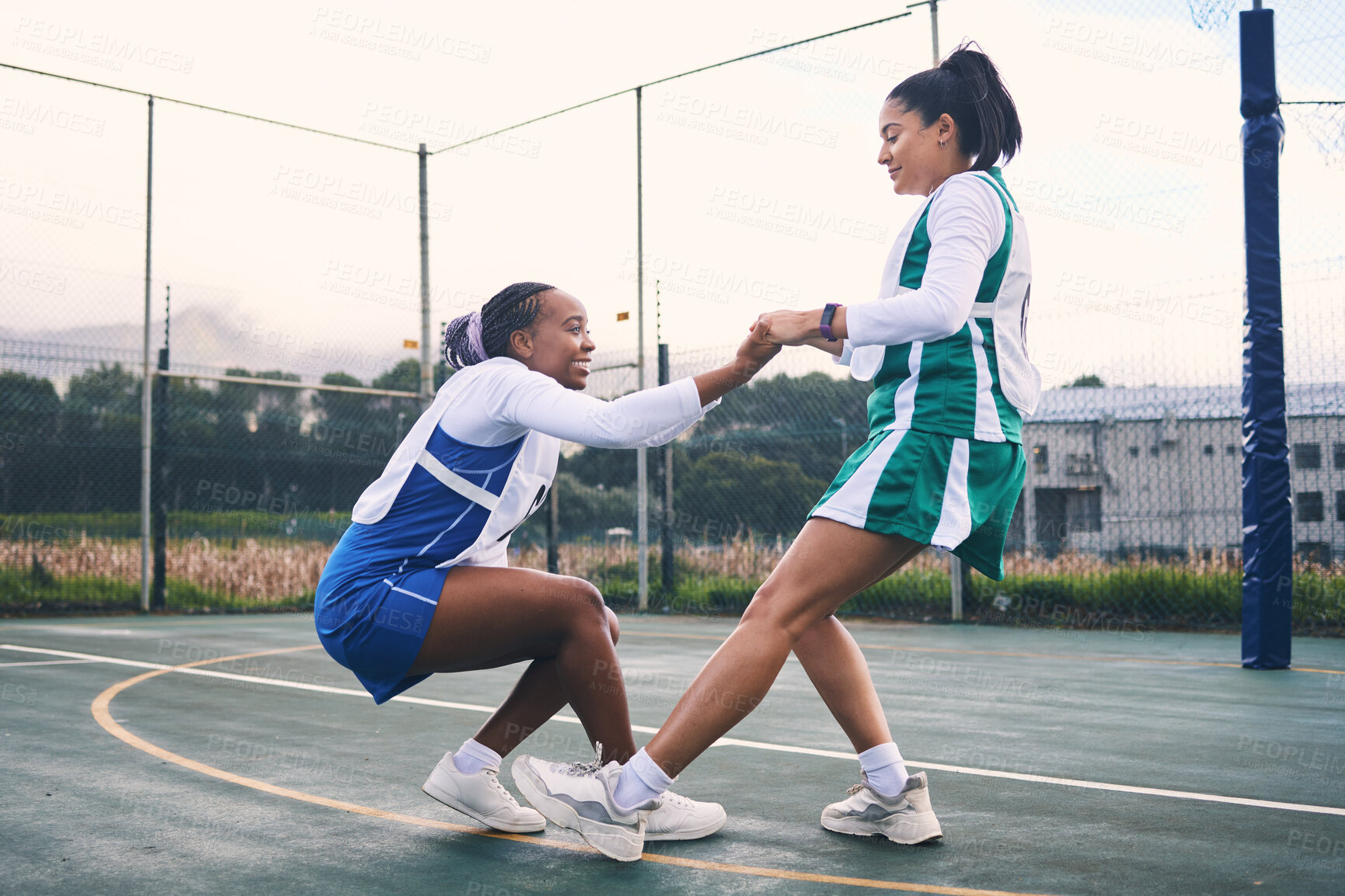 Buy stock photo Netball help, support and outdoor game of team sports with fitness and exercise. Helping, sportsmanship and student women with teamwork and collaboration in a sport competition with happiness