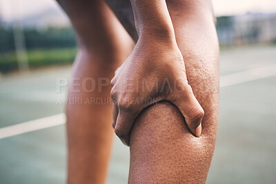 Buy stock photo Knee injury, fitness pain and netball athlete on a outdoor sports court with joint or muscle problem. Training, exercise and black woman hands holding legs with muscle and wellness issue from game