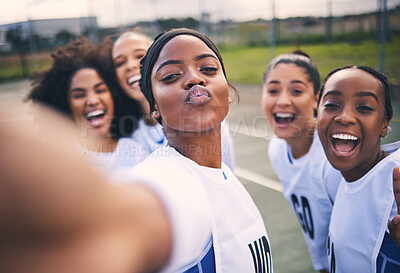Buy stock photo Netball, happy selfie and portrait of girl students on a outdoor sports court for game or workout. Exercise, kiss face and athlete group together for sport, student wellness and teamwork for training