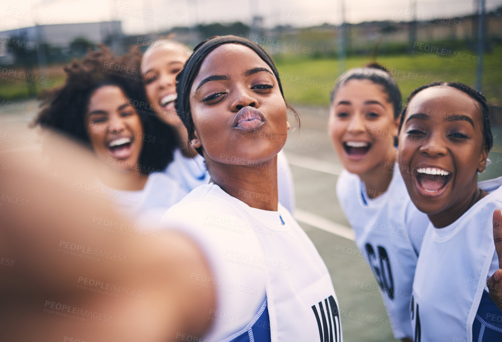 Buy stock photo Netball, happy selfie and portrait of girl students on a outdoor sports court for game or workout. Exercise, kiss face and athlete group together for sport, student wellness and teamwork for training