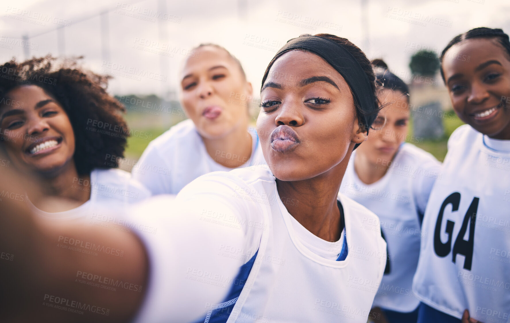 Buy stock photo Netball, selfie and portrait of women students on a outdoor sports court for game or workout. Exercise, kiss face and athlete group together for sport, student wellness and teamwork for training