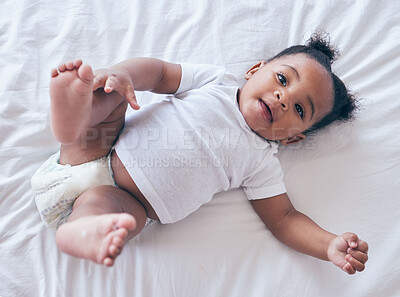 Buy stock photo Happy baby, portrait and girl on a bedroom bed relax and calm in a nursery after rest. Young newborn, child and kid with a diaper in the morning with wellbeing and childcare from above in a house