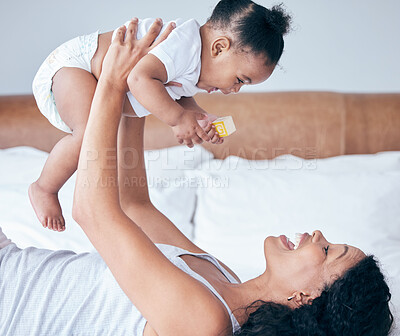 Buy stock photo Happy mom, bedroom and baby in the air with parent care and love at home in morning, Child, mother and happiness of a young mama with a kid playing and having fun together in a house with childcare