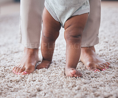 Buy stock photo Baby feet, youth walking and kid learning with mother in living room lounge with mobility development. Floor, home and first steps of a young child with mama love, care and support in a house