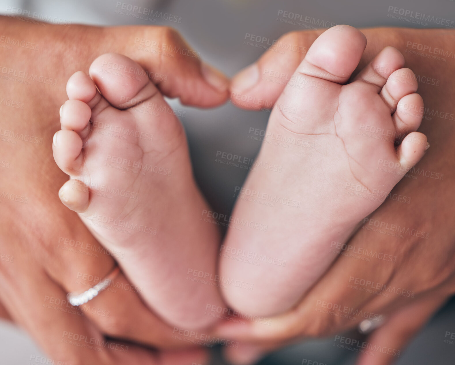 Buy stock photo Baby, feet and hands of mother closeup with newborn for love, care or family bond in their home. Zoom, mom and foot of infant for motherhood, protection or child development, maternity and caring