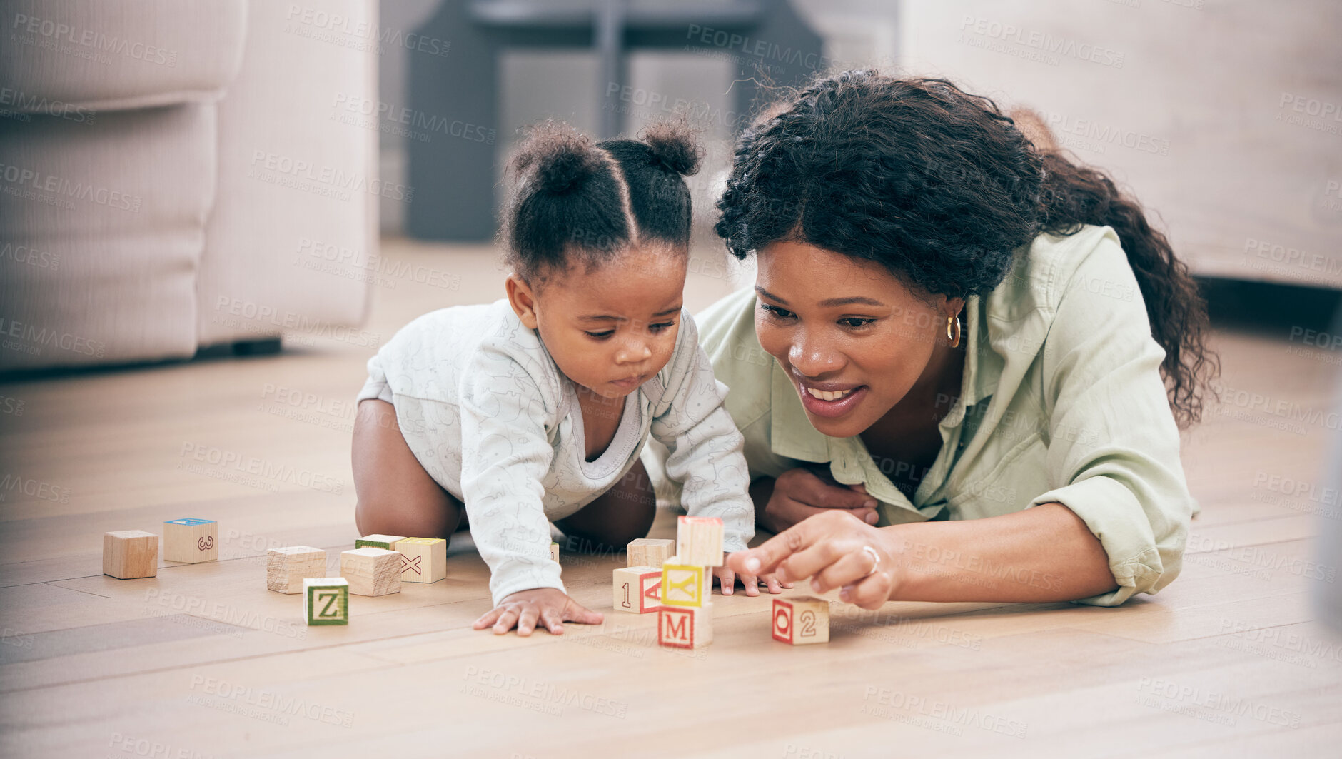 Buy stock photo Baby, mother and toy building blocks for child knowledge development on living room floor. Family home, teaching and mom with girl toddler learning and helping with happiness and a smile with love