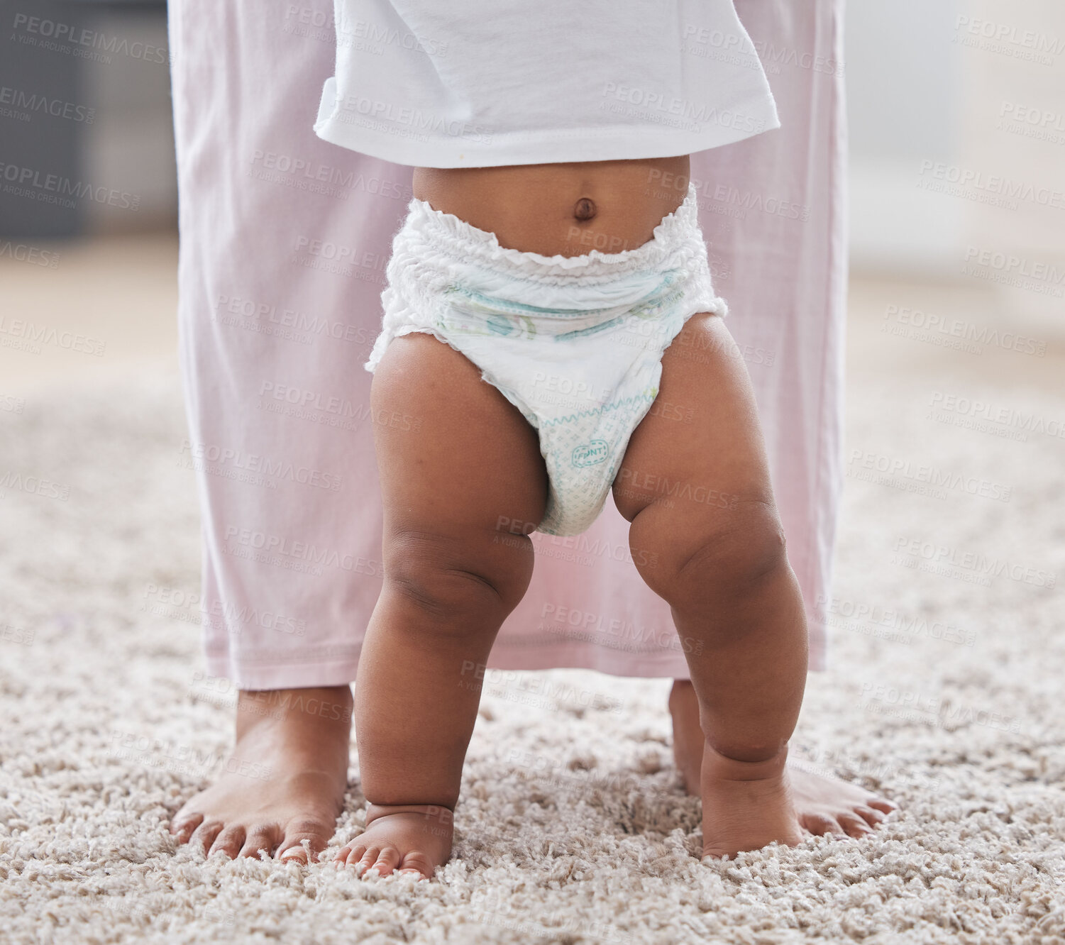 Buy stock photo Baby legs, learning and walking with mother, support and first steps of healthy body development. Closeup mom teaching child to walk, balance and feet on carpet for growth, milestone and motor skills