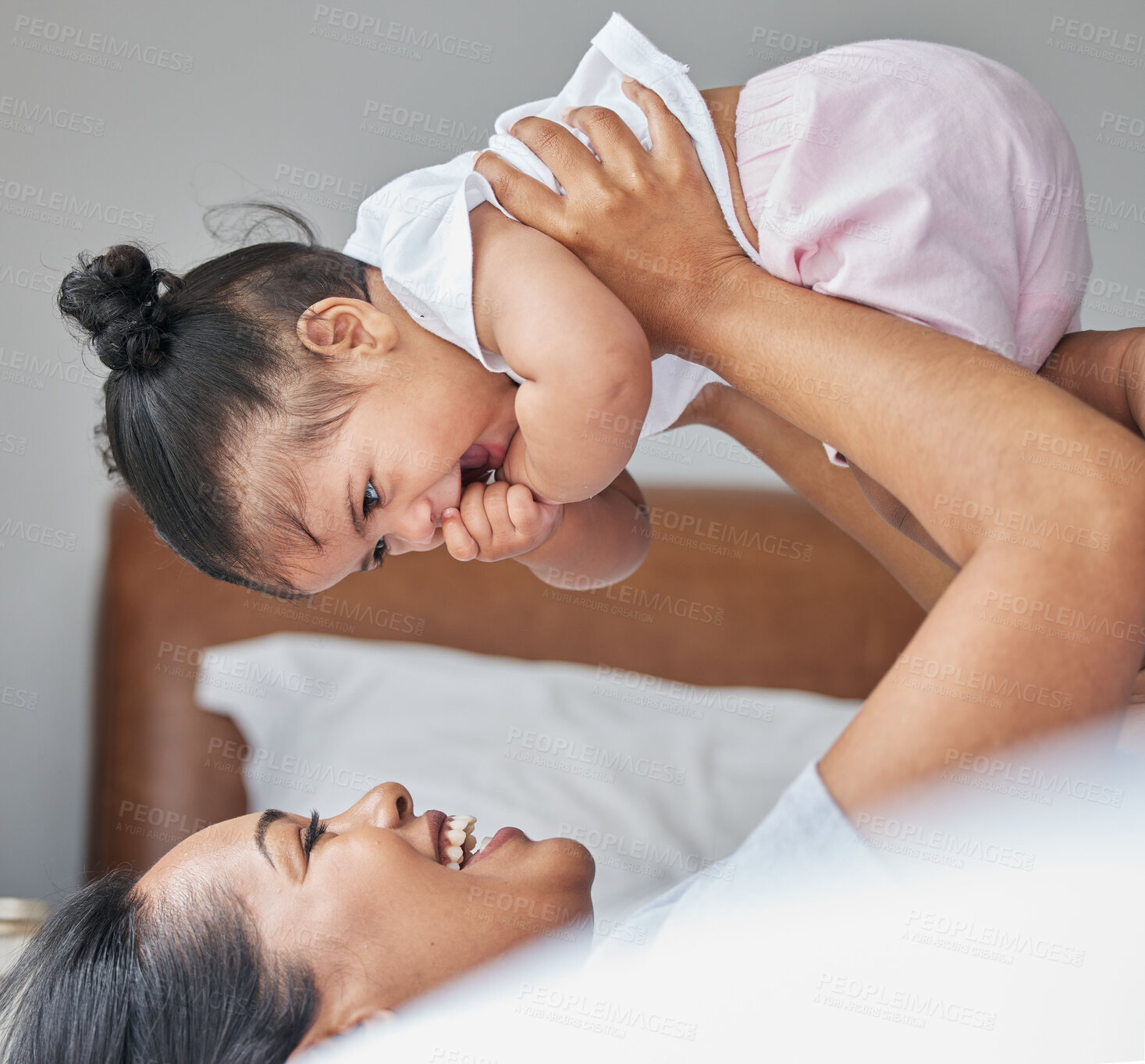 Buy stock photo Love, mother and baby in bedroom, air and care with happiness, playful and cheerful. Mama, female child and kid on bed, smile and bonding together, break and loving with toddler, family and relax