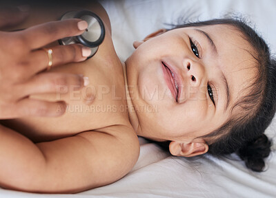 Buy stock photo Baby, stethoscope and health and medical doctor care for happy child heart, lungs and wellness. Face and smile of toddler girl kid on a hospital bed for growth and development check with pediatrician