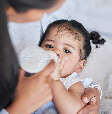 Buy stock photo Baby drinking bottle, formula and nutrition with feeding and family, health and growth with early childhood development. Mother feed infant child milk, people at home with health and wellness