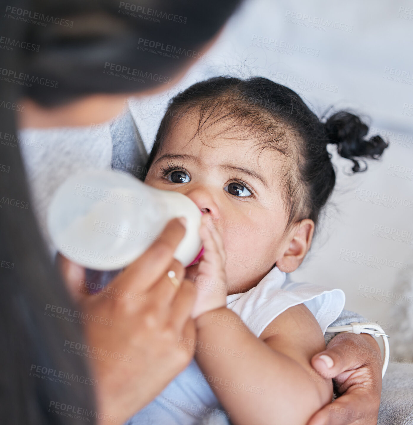 Buy stock photo Mother feeding baby milk, formula and bottle with nutrition and family, healthy and growth with early childhood development. Child is drinking, meal and people at home with health and wellness