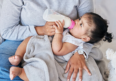 Buy stock photo Mom feeding baby, milk formula and nutrition with drinking, family and healthy, growth and childhood development. Woman feed infant child at home, meal and hands with health and wellness