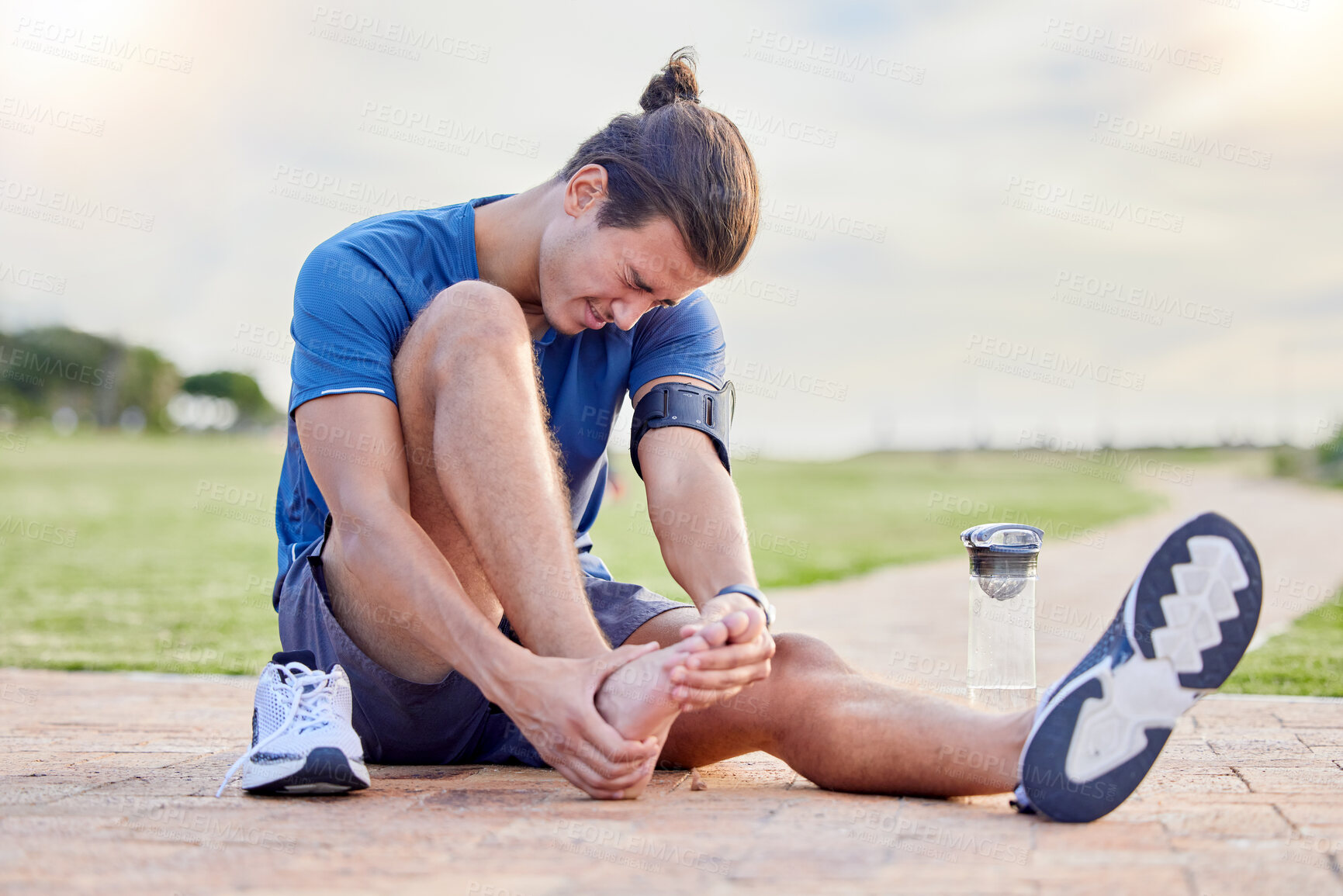 Buy stock photo Fitness, sports injury and foot pain with man in park for muscle spasm, inflammation and joint problem. Running, workout and exercise with athlete and emergency for health, suffering and broken ankle