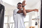 Stretching, fitness and portrait of a black man at the gym for training, muscle and arms warm up. Exercise, focus and African athlete preparing for a workout, ready for sports and cardio for health