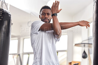 Buy stock photo Stretching, fitness and portrait of a black man at the gym for training, muscle and arms warm up. Exercise, focus and African athlete preparing for a workout, ready for sports and cardio for health
