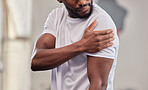 Shoulder pain, fitness and black man with injury in gym after accident, workout or training. Sports, health and male athlete with fibromyalgia, inflammation or arthritis, tendinitis or painful arm.