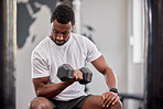 Black man, weight training and gym dumbbell of a athlete doing bodybuilder cardio. Healthy, wellness and sports workout for strong arm muscle in a exercise studio with power lifting and fitness