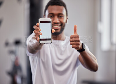 Buy stock photo Phone screen, mockup and black man with thumbs up in gym for exercise or fitness. Sports, portrait and male athlete with smartphone for branding, advertising or marketing with hand emoji for success.
