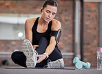 Leg pain, fitness and woman with injury in gym after accident, workout or training. Sports, health and young female athlete with fibromyalgia, inflammation or arthritis, tendinitis or painful ankle.