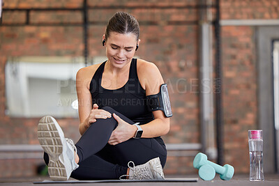 Buy stock photo Knee pain, fitness and woman with injury in gym after accident, workout or training. Sports, health and young female athlete with fibromyalgia, inflammation or arthritis, tendinitis or painful legs.