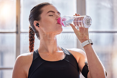 Buy stock photo Fitness, drinking water and woman in gym for health, wellness or hydration. Sports, nutrition or thirsty female athlete with liquid after training, workout or exercise, running or cardio for strength