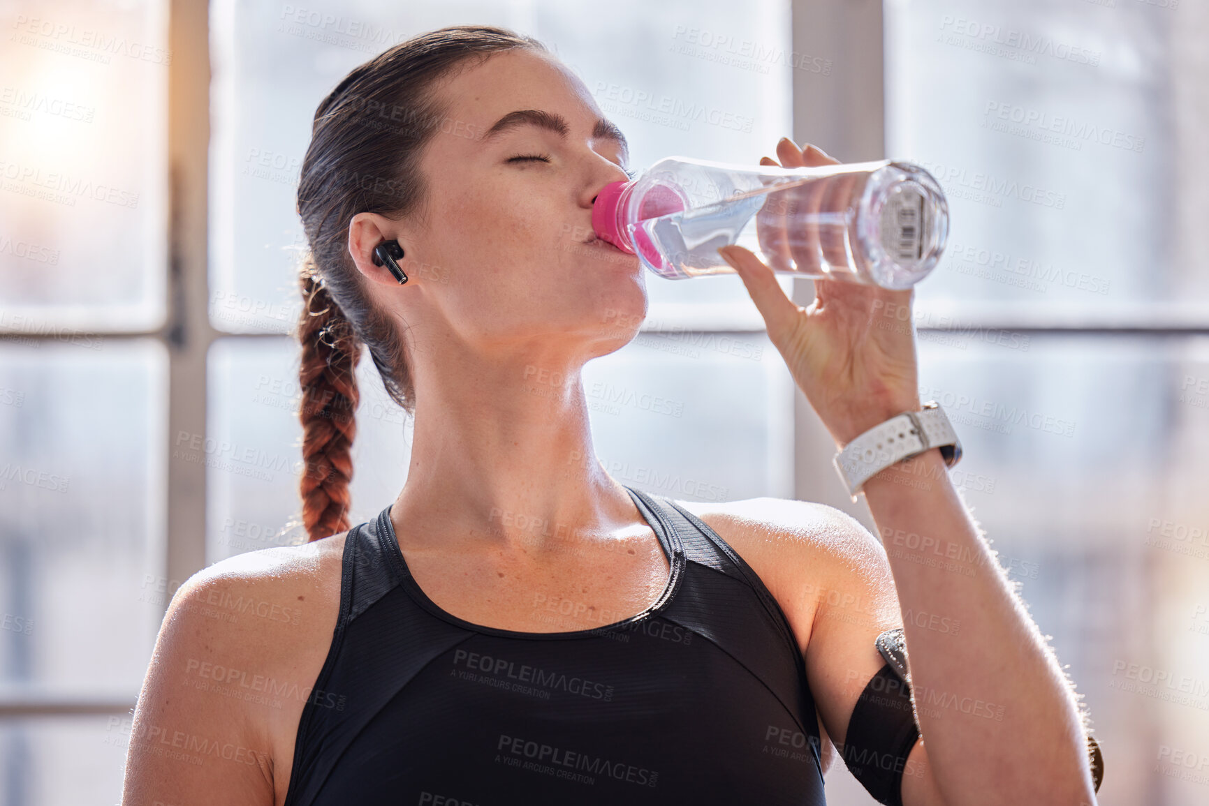 Buy stock photo Fitness, drinking water and woman in gym for health, wellness or hydration. Sports, nutrition or thirsty female athlete with liquid after training, workout or exercise, running or cardio for strength
