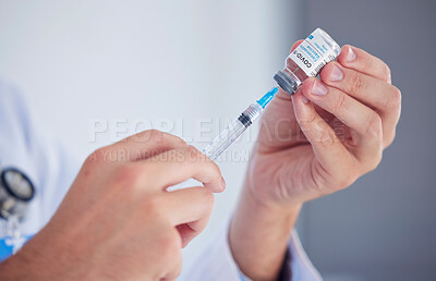 Buy stock photo Doctor, hands and covid vaccine with syringe for cure, illness or flu shot at the hospital. Hand of medical professional extracting vial for corona virus immunization, vaccination or disease