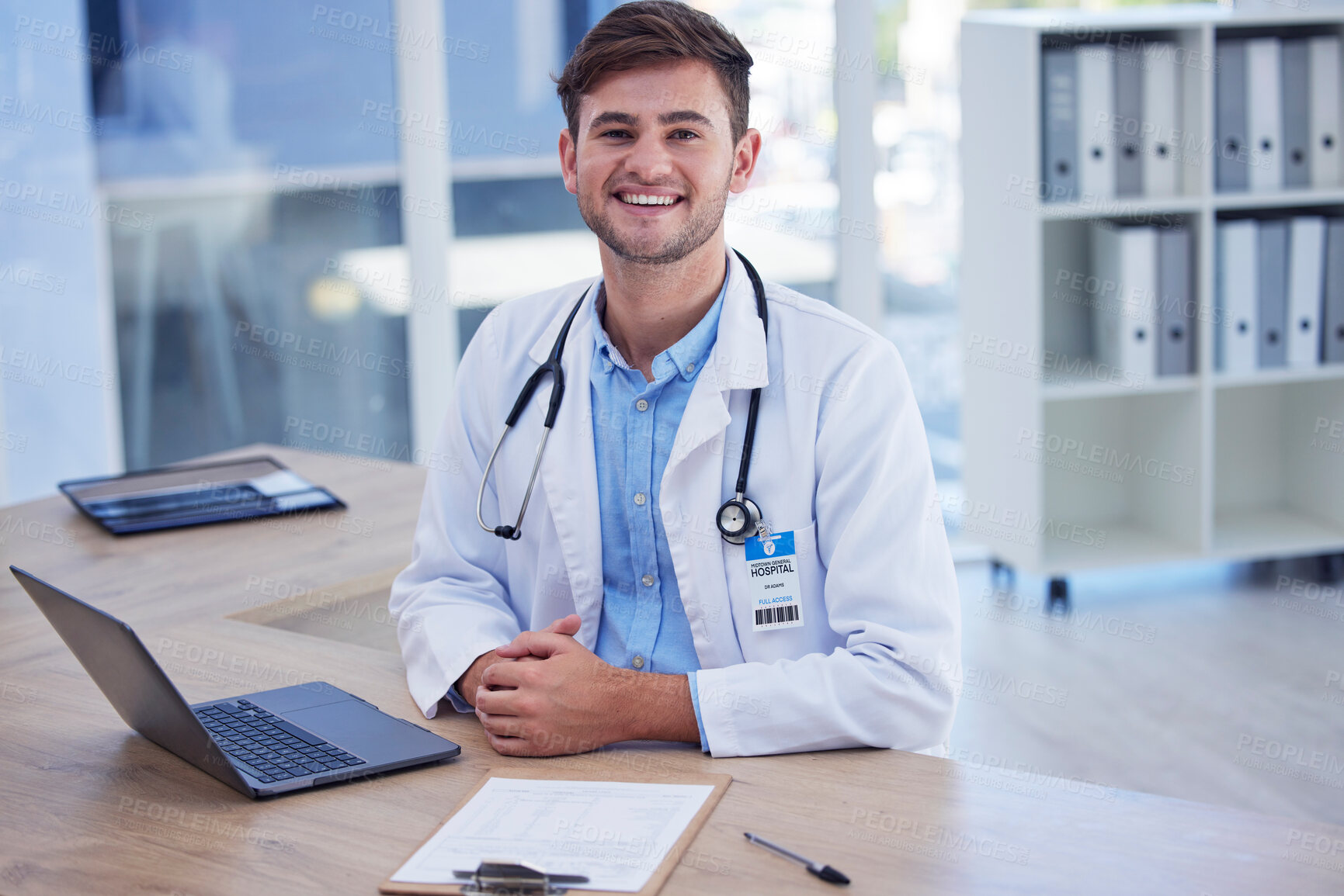 Buy stock photo Man, doctor and portrait smile with laptop for healthcare, Telehealth or research at office desk. Happy male medical professional smiling by computer for medicare innovation or development at clinic