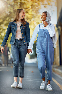 Buy stock photo Friends, diversity and holding hands with women in road for support, spring and travel together. Community, happy and smile with girls walking in street path for muslim, social and solidarity 