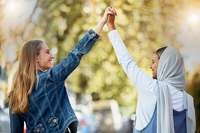 Buy stock photo Support, diversity and lesbian couple holding hands in the city for trust, love and solidarity. Happy, freedom and Muslim girl with a woman for affection, care and happiness in a relationship