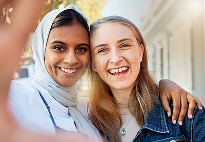 Buy stock photo Selfie, friends and women, hug and outdoor with freedom, carefree and cheerful together in town. Portrait of Muslim girls with joy, smile and ladies embrace, happiness and reunion on summer break