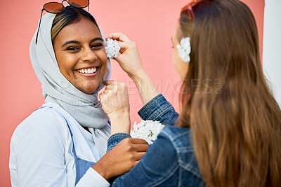 Buy stock photo Women, muslim and friends portrait with flower decoration, spring celebration or bonding in city. Young student, gen z girl and islam with smile, happiness and fashion for urban adventure for support