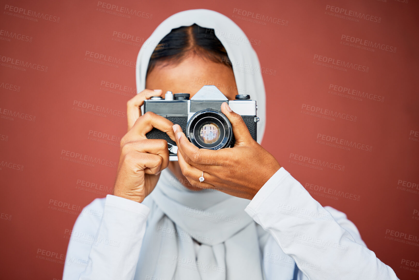 Buy stock photo Photography, muslim woman taking picture with camera and mockup with smile isolated on red background. Creative professional lifestyle photographer in hijab, hobby or career taking photo in studio.