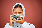 Photography, portrait of muslim woman holding camera and mockup with smile isolated on red background. Creative professional lifestyle photographer in hijab, hobby or career taking photo in studio.
