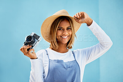 Buy stock photo Happy, camera and photographer with portrait of woman for creative, retro and shooting photos. Fashion, happiness and vintage with girl and photography for picture, lens and blue wall background