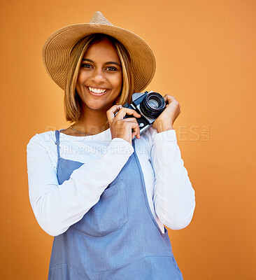 Buy stock photo Smile, camera and photographer with portrait of woman for creative, retro and shooting photos. Fashion, happiness and vintage with girl and photography for picture, lens and focus in wall background
