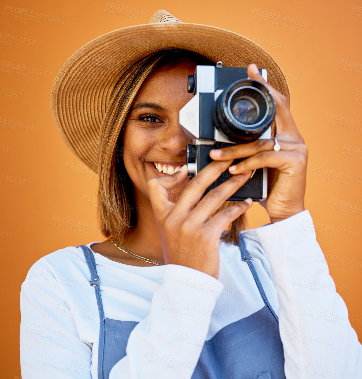 Buy stock photo Portrait, photographer and black woman with camera, smile and creative against studio background. Face, African American female artist or lady with device, happiness or freelancer with casual clothes